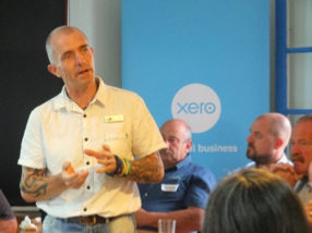 Image: Jamie Allen speaks to local business owners about Taranaki Retreat, the services it offers, and mental health in the region.